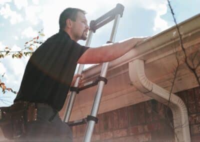 Home inspector from Palmer Inspections examining a roofline during a home inspection in White Oak, Texas