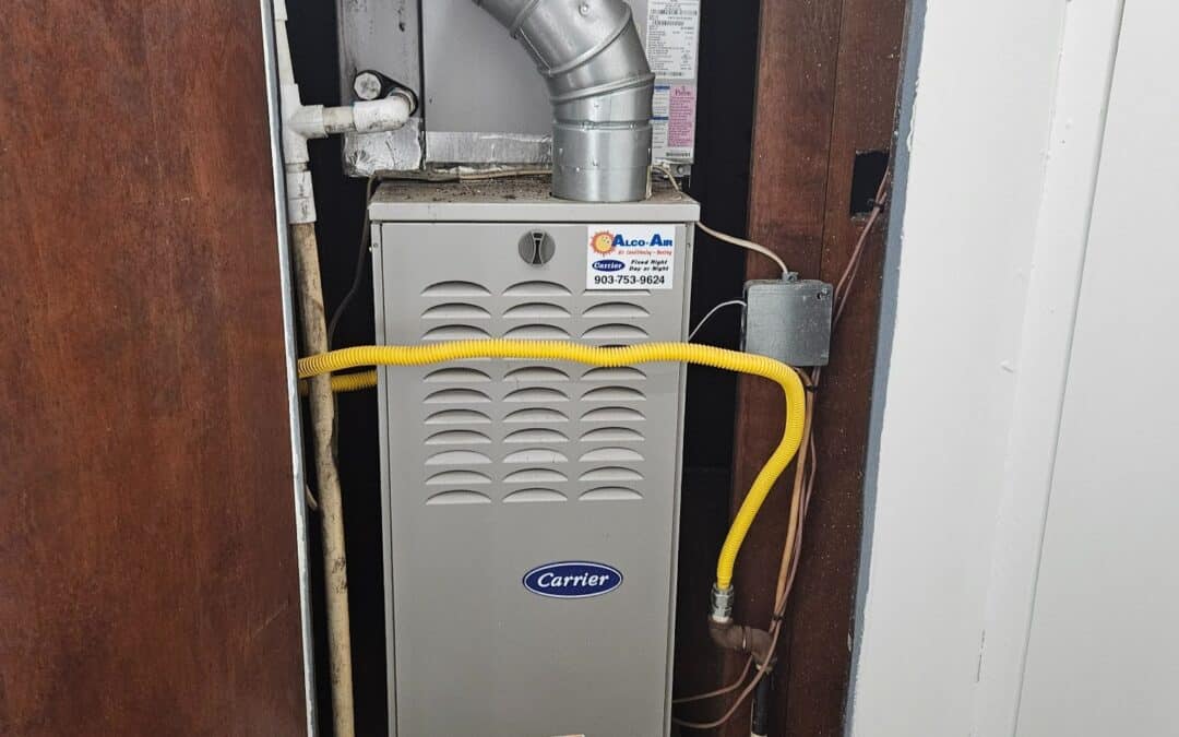Interior gas furnace inspected inside HVAC closet in East Texas home, showing venting, gas line, and safety clearances
