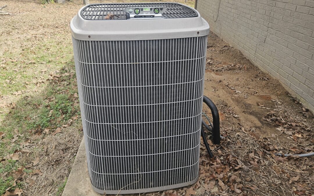 Residential air conditioning condenser unit inspected during home inspection in Longview Texas