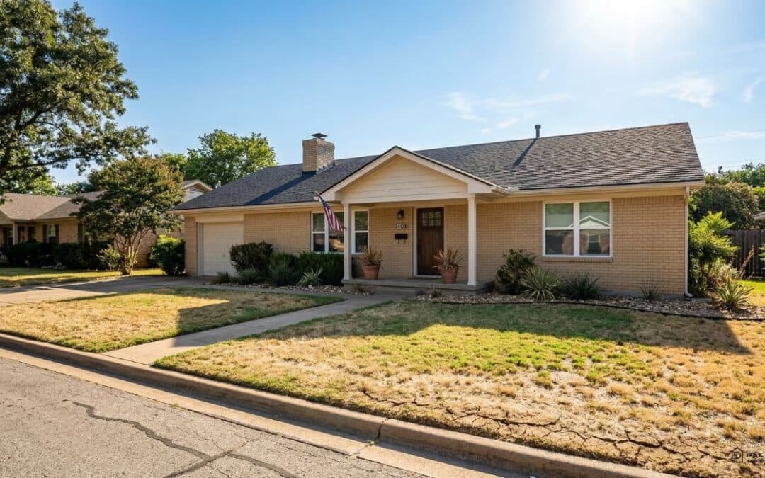 A spacious home with a large yard and driveway, illustrating foundation maintenance tips for homeowners.