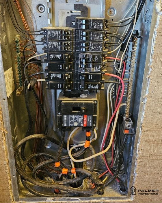 Interior view of a residential electrical breaker panel during a professional home inspection in White Oak, TX, highlighting the most common issues found in East Texas homes.