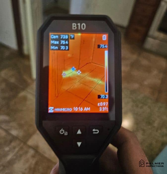 Infrared camera screen detecting moisture issues during a home inspection, showing how inspections help real estate deals close faster in East Texas